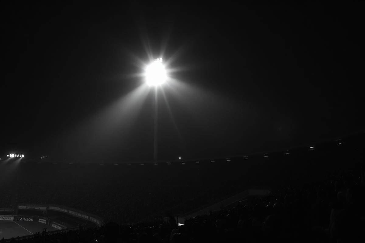 Floodlit stadium at night